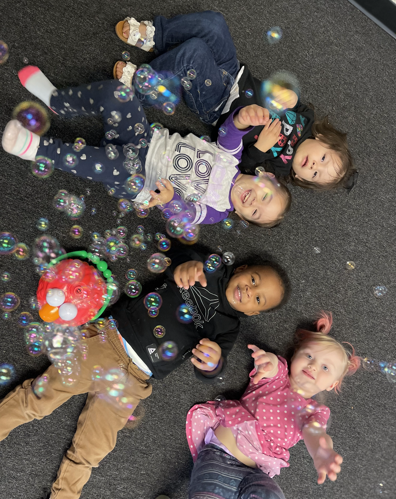 kids on floor with bubbles